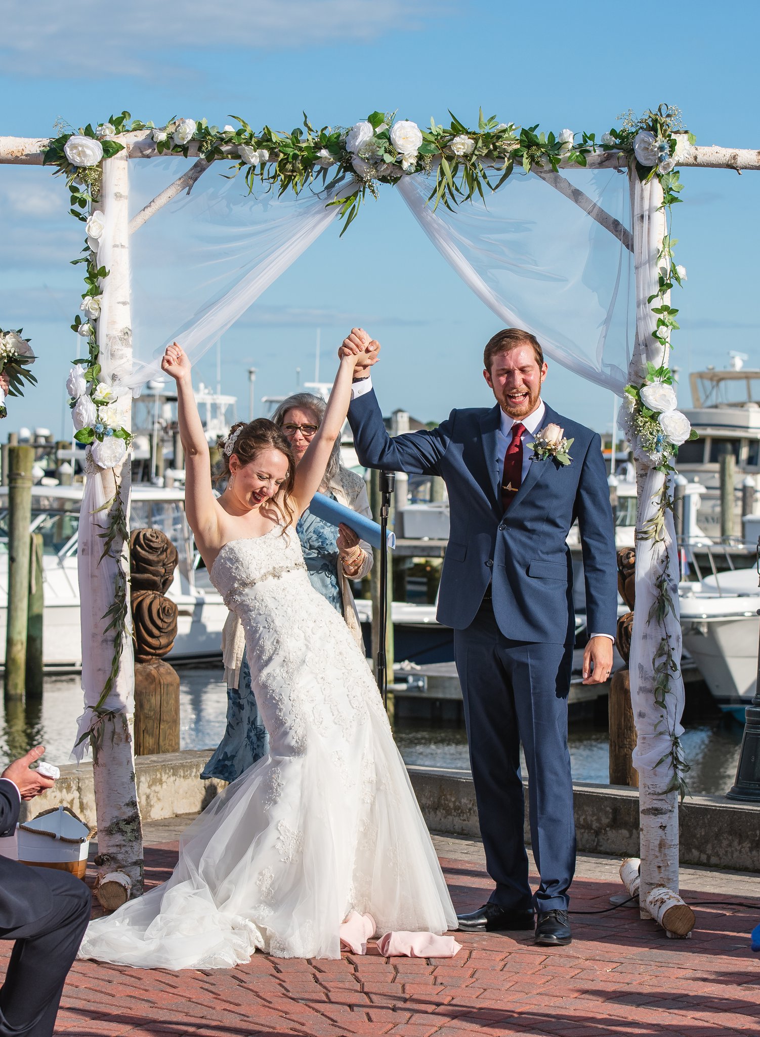 bride and groom cheer at Saybrook Point Inn wedding ceremony