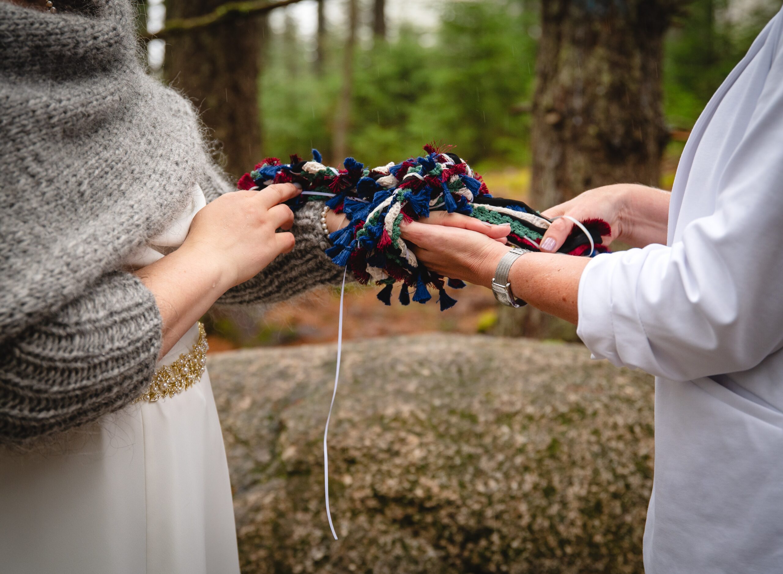 handfasting ritual during a mountain elopement ceremony in new hampshire